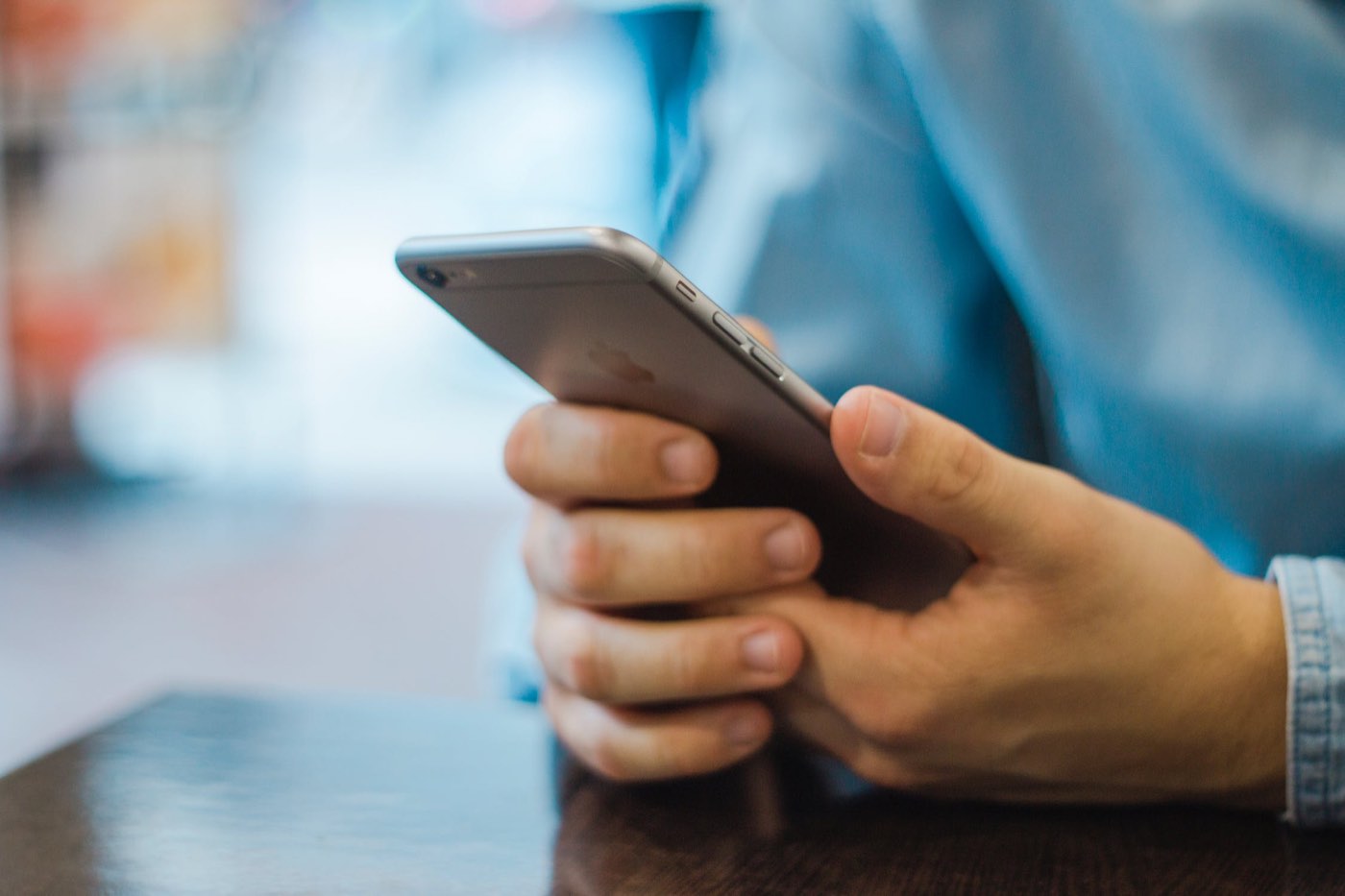 Person holding a mobile phone